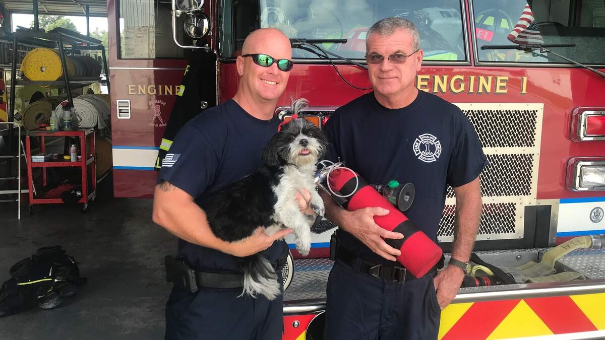 Mercy is pictured with Ridgeland firefighters Grady McElhaney and Adolph Sauls.