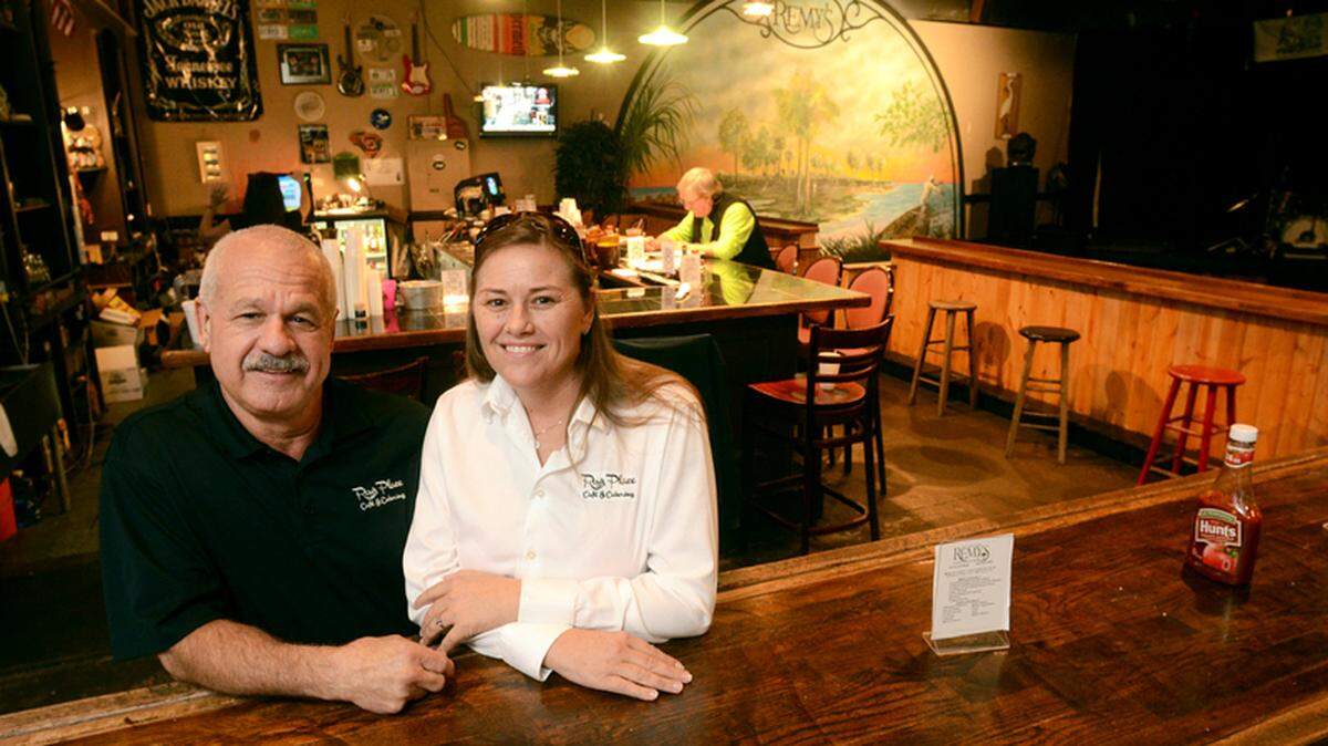 Remy's Bar & Grill owners Roy and Becky Prescott are photographed at a table from the original Remy's on Wednesday. The establishment, a longtime Hilton Head Island fixture at several south island locations, is about to close for good.