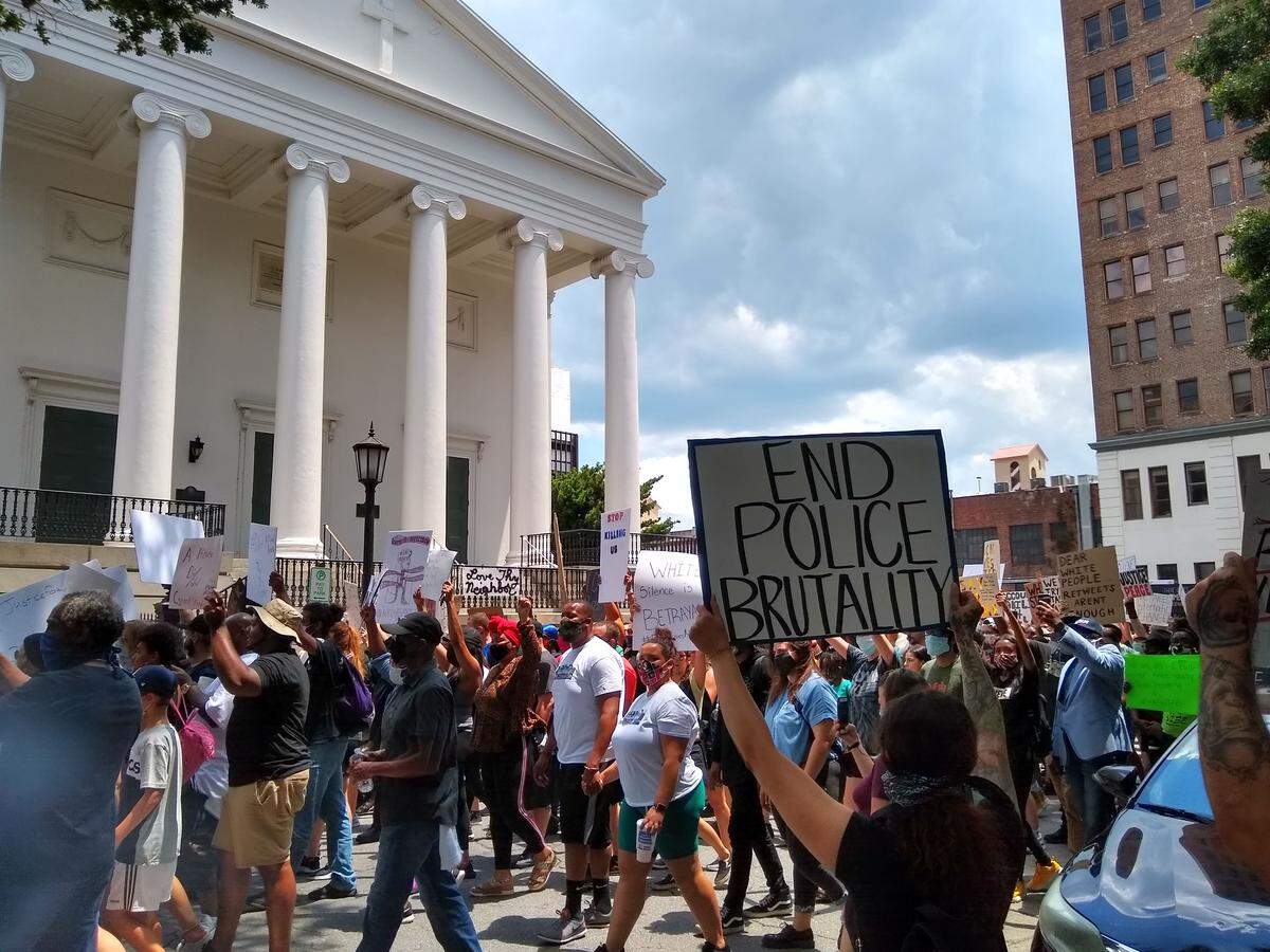 In Savnanah’s Johnson Square on Sunday, May 31, 2020, protesters held signs and chanted “don’t forget about George,” referencing George Floyd, an African American man died at the hands of Minneapolis police days earlier.
