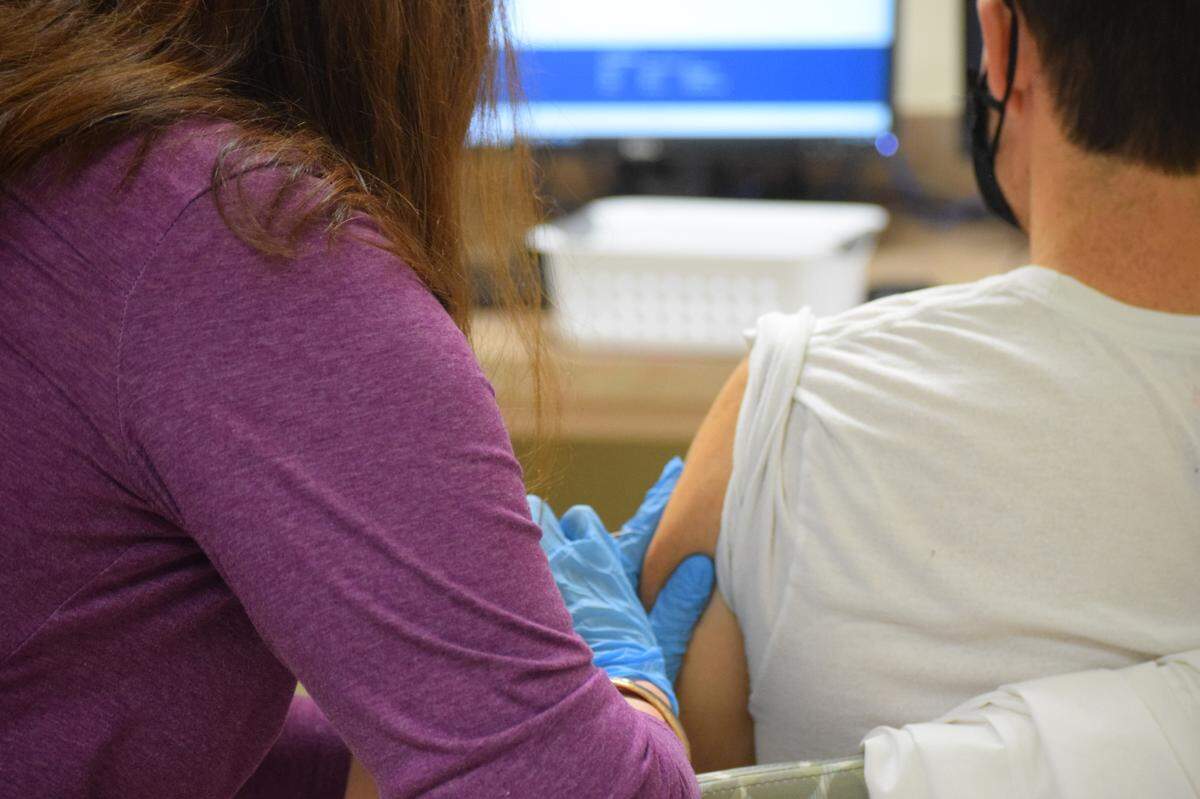 Beaufort Memorial Hospital CEO Russell Baxley receives a Pfizer-BioNTech coronavirus vaccine dose on Monday, Dec. 21, 2020.
