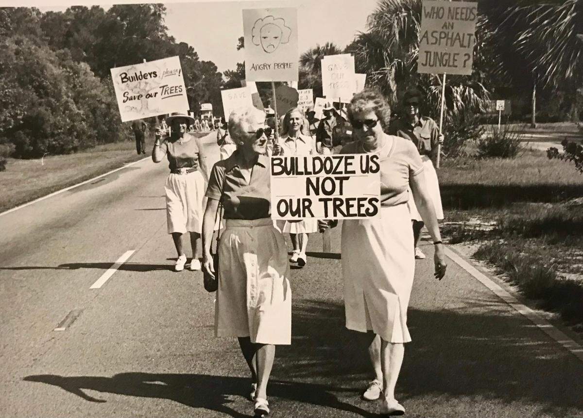 Katie Callahan, left, and Dorothea Griffin lead a “Save Our Trees” march down Pope Avenue on Hilton Head in July 1984.