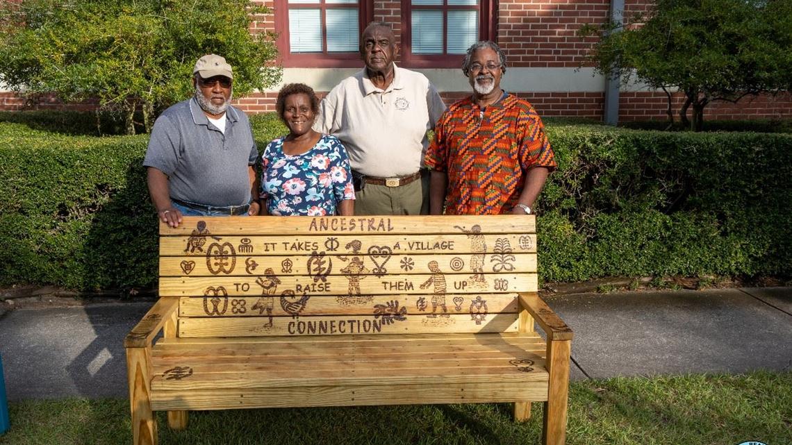 Artist Hank Herring, far right, poses with Washington Street Park sponsors with “Ancestral Connection.” Herring is the owner of Green Herring Art and Framing Studio on Bay Street.