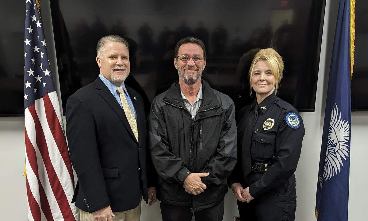Attending Monday morning’s swearing-in ceremony were Beaufort City Manager Scott Marshall (left), former chief Dale McDormand (center) and Stephenie Price, who now serves as interim chief.