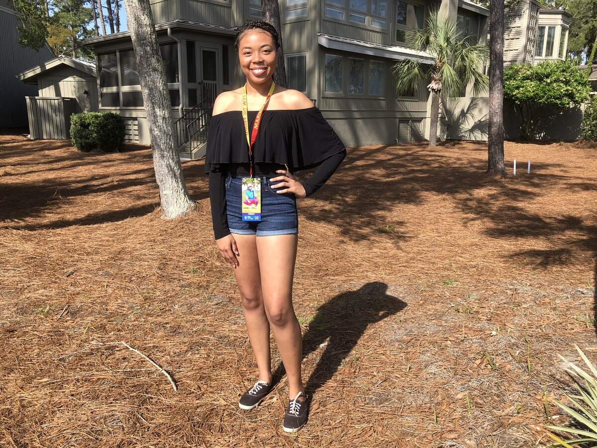 Renee Pierrey wore an off-the-shoulder top and body glitter, and she finished her ensemble in comfy sneakers.