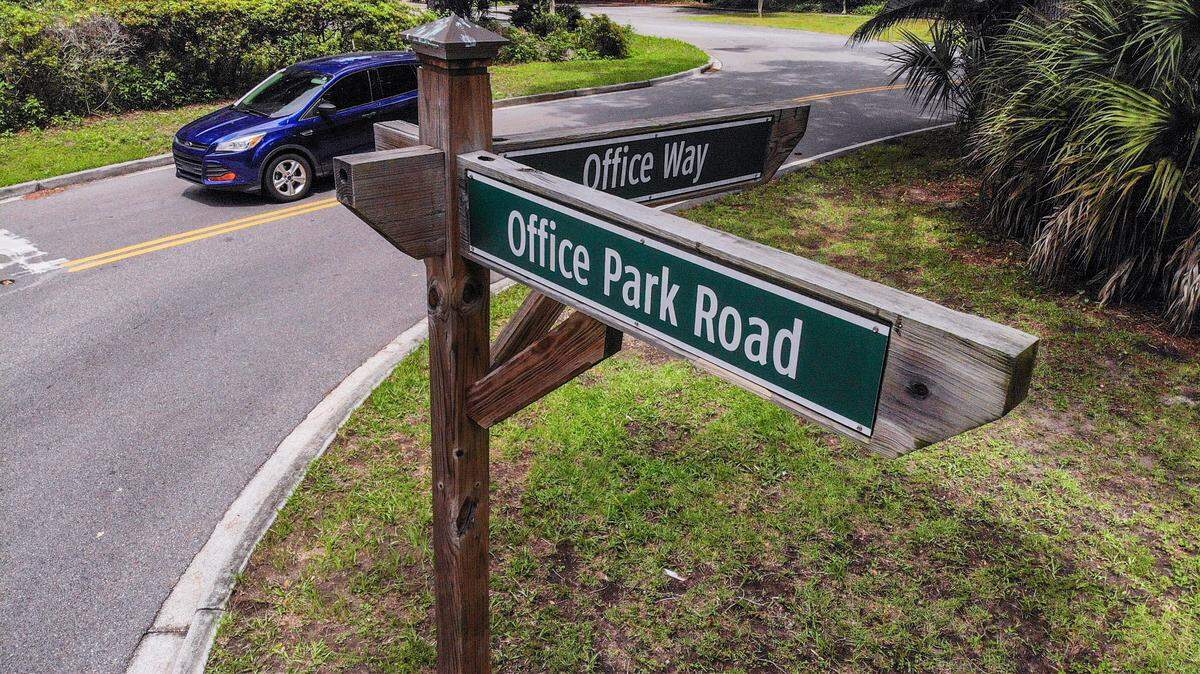 A vehicle leaves Office Way on Aug. 16, 2023, a stretch of road that has several decaying and vacant buildings where some Hilton Head Island employers would renovate them if the Town of Hilton Head Island would change density rules.