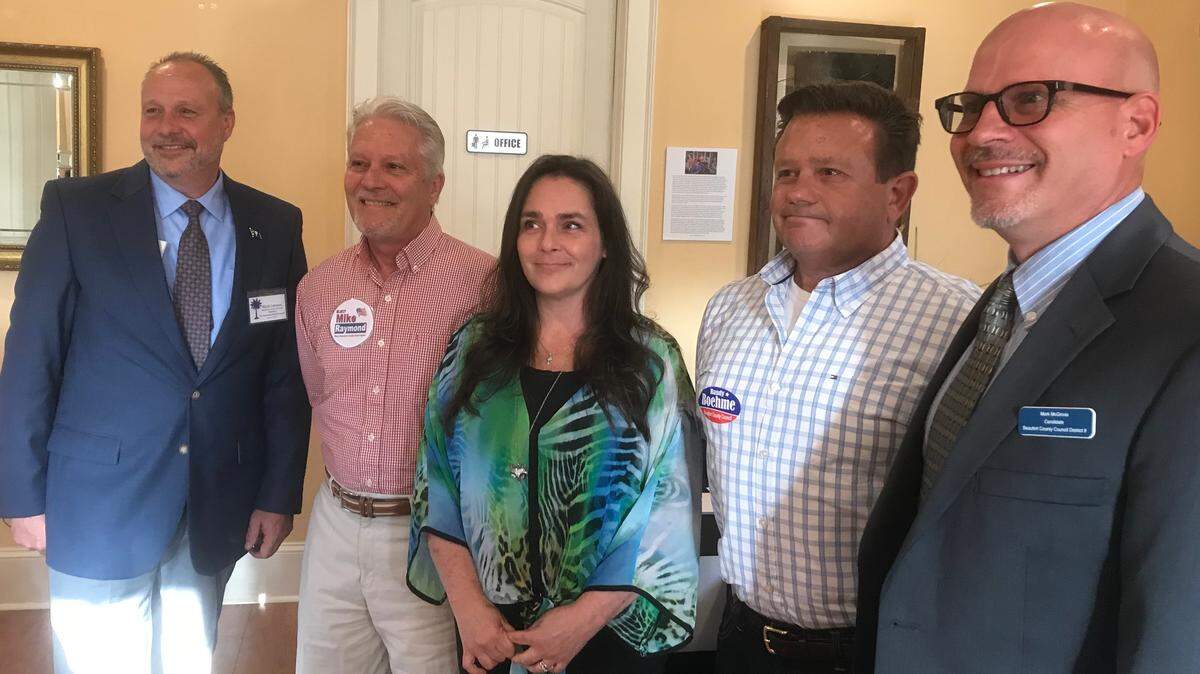 From left, Mark Lawson, Mike Raymond, Laura Sterling, Randy Boehme and Mark McGinnis, candidates for the Beaufort County Council District 9 seat, pose for a picture after a forum Monday, May 21, 2018, at the Greater Bluffton Chamber of Commerce in Bluffton, S.C.