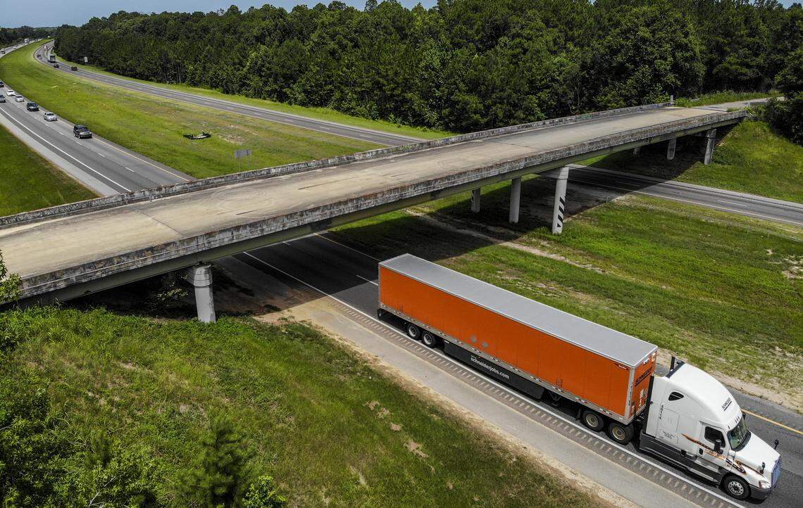 A semi-tractor trailer passes underneath the Purrysburg Road overpass on Monday as it travels northbound on Interstate 95 into Hardeeville town limits. This is the site where the developer of River Port Business Park, City of Hardeeville and Jasper County want a new interchange that will connect to U.S. 17 and U.S. 321 in Jasper County.