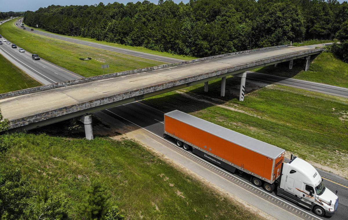A semi-tractor trailer passes underneath the Purrysburg Road overpass on Monday as it travels northbound on I-95 into Hardeeville town limits. This is the site where the developer of River Port Business Park, City of Hardeeville and Jasper County plan to build a new interchange with I-95, Exit 3.