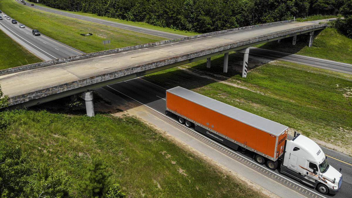 A semi-tractor trailer passes underneath the Purrysburg Road overpass on Monday as it travels northbound on Interstate 95 into Hardeeville town limits. This is the site where the developer of River Port Business Park, City of Hardeeville and Jasper County want a new interchange that will connect to U.S. 17 and U.S. 321 in Jasper County.