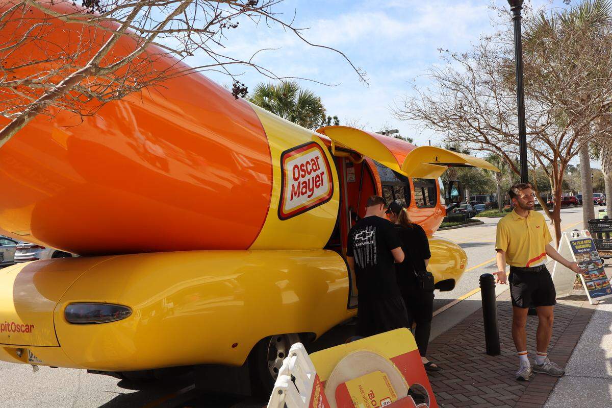 Luigino Croce, one of 12 “Hotdoggers” tasked with driving an Oscar Mayer Wienermobile across the country, introduced locals to the iconic 27-foot vehicle outside the Shelter Cove Kroger on Hilton Head Island the morning of Visitors can tour the Wienermobile, take photos and get free “Wienermobilia” during its four stops in Beaufort County over St. Patrick’s Day weekend.