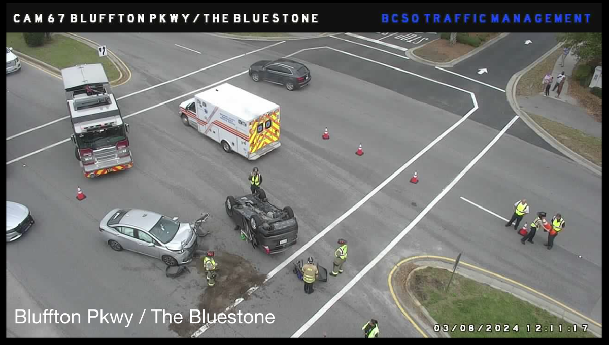 A car overturned during a two-vehicle collision on Bluffton Parkway around noon Friday.