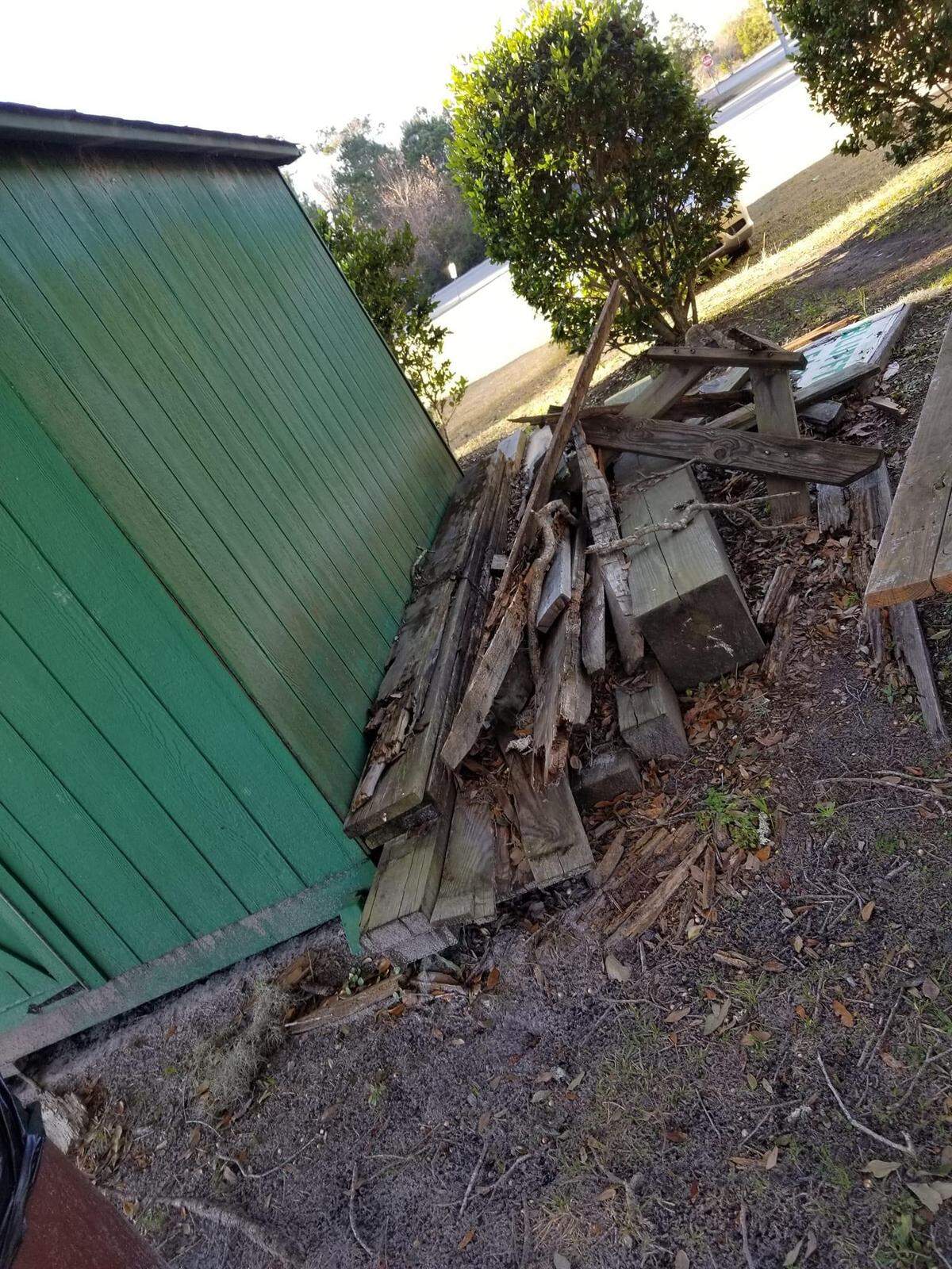Debris that can attract vermin sits behind a building on the grounds of Eagles Field.