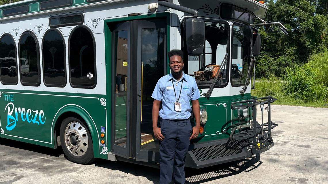 Deonte Ellis, Palmetto Breeze Transits’ youngest driver, is connecting communities across the Lowcountry. Photographed: Deonte Ellis with a Palmetto Breeze “The Breeze” trolley on Thursday, June 26, 2025.