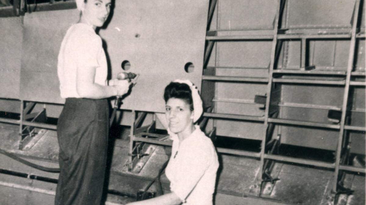 Rosie Bonavita Hickey, right, set her second speed record in 1944 with riveting partner Susan Esposito, left, at the Eastern Aircraft Division plant in Tarrytown, N.Y.