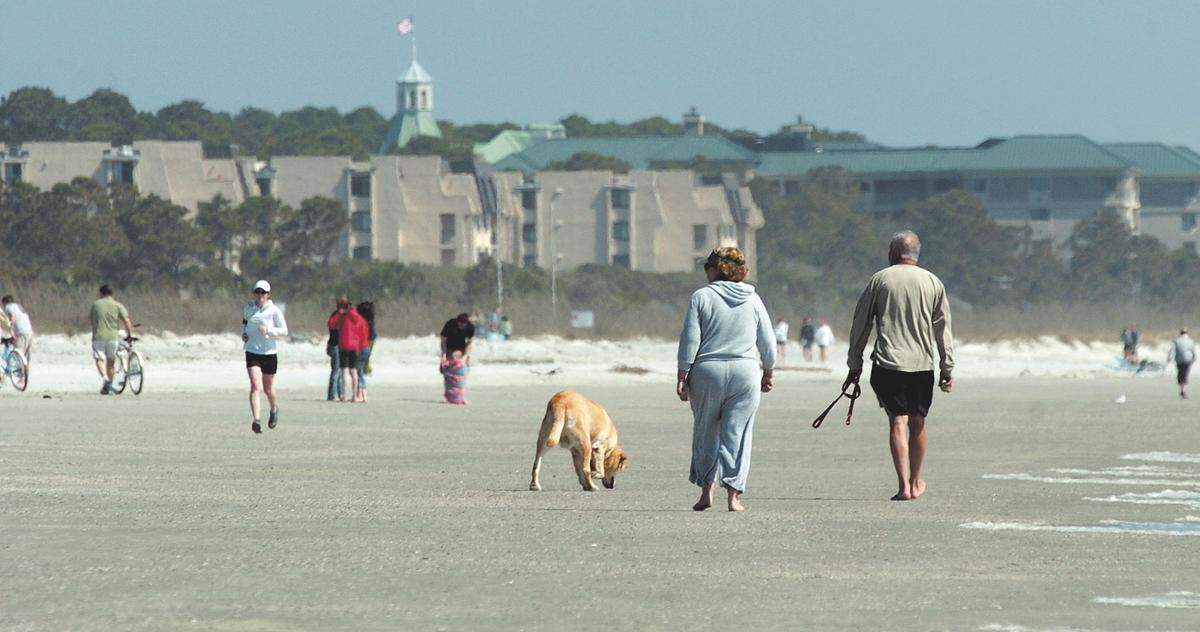 A couple walks with their dog last year near Burkes Beach on Hilton Head Island. From Memorial Day to Labor Day, animals are not permitted on Hilton Head beaches from 10 a.m. to 5 p.m. At all other times, pets must be on a leash or under positive voice control. Dogs are allowed on the beach at Hunting Island State Park in Beaufort, but must be on a leash.