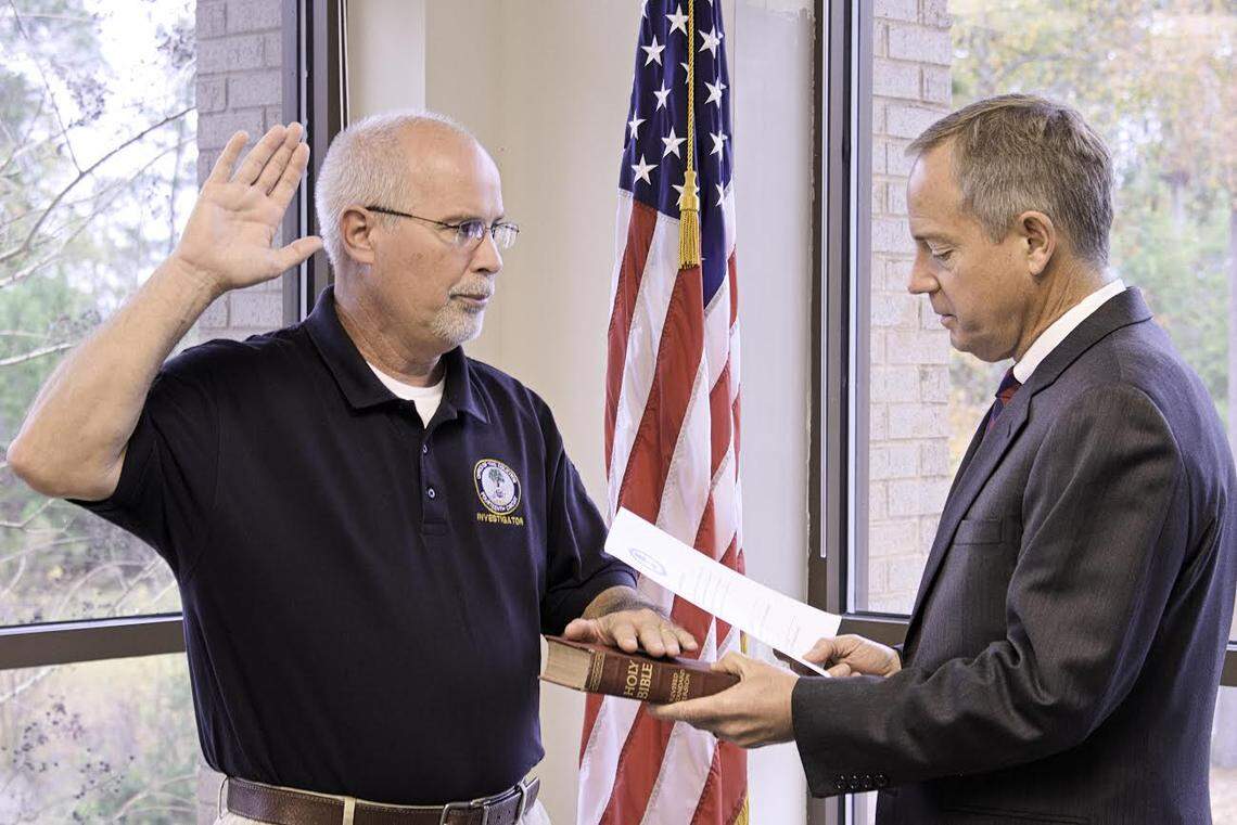 Joey “JoJo” Woodward, left, is sworn in as an investigator by Solicitor Duffie Stone in 2018.