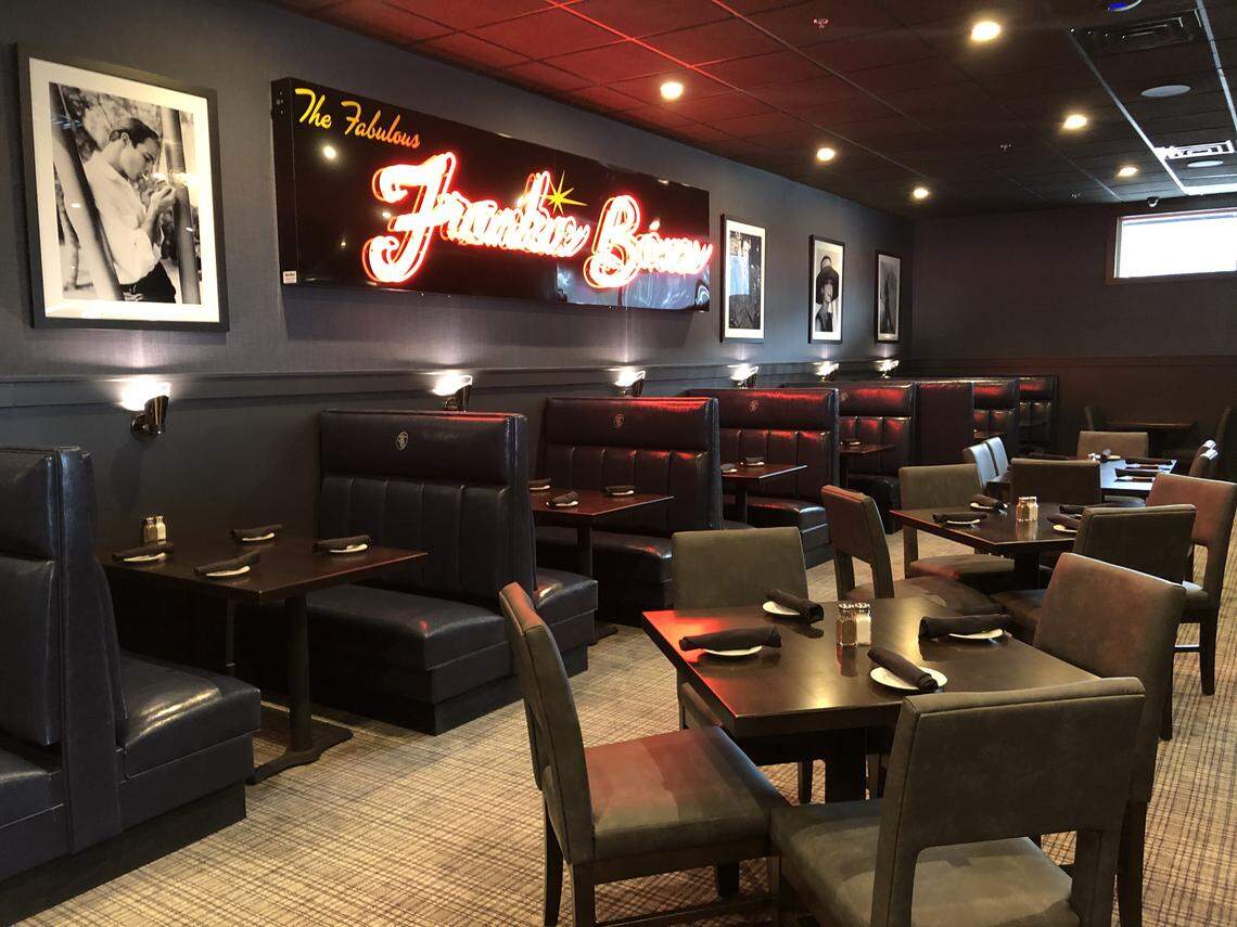Frankie Bones’ Bluffton restaurant has a gray and blue interior, with the familiar logo in red.