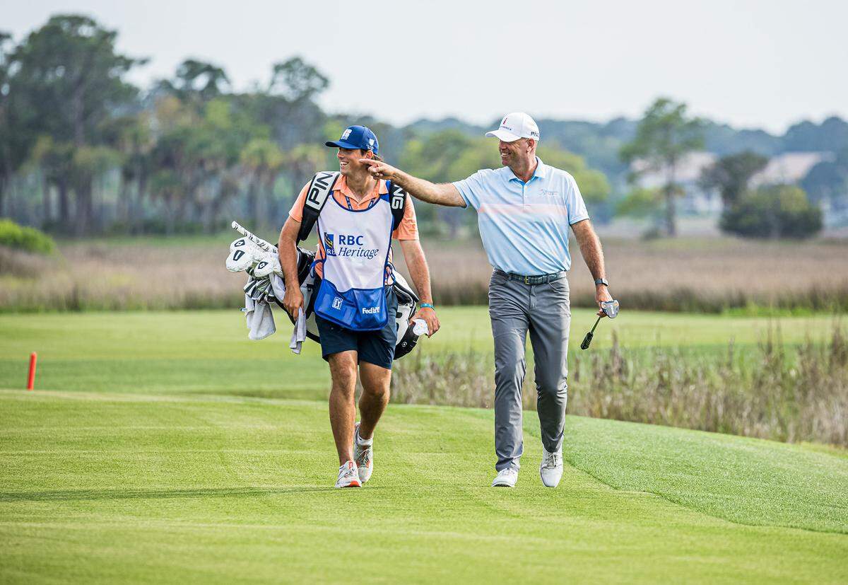 Stewart and Reagan Cink enjoy the crowd reception up the 18th fairway during the final round of tournament play of the RBC Heritage Presented by Boeing on Sunday, April 18, 2021 at Harbour Town Golf Links in Sea Pines on Hilton Head Island.