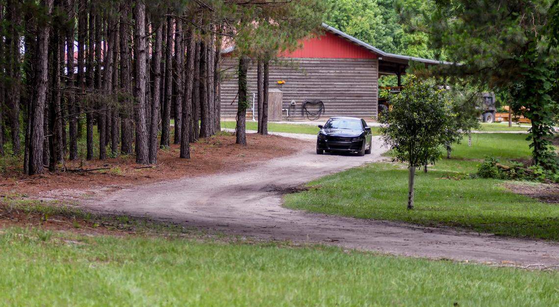 An unidentified car blocks the approach to the Murdaugh family property on Tuesday, June 8, 2021 near the dog kennels where Maggie Murdaugh, 52, and her son Paul Murdaugh, 22, died from gunshot wounds in an apparent homicide in Colleton County.
