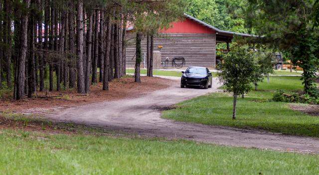 An unidentified car blocks the approach to the Murdaugh family property on Tuesday, June 8, 2021 near the dog kennels where Maggie Murdaugh, 52, and her son Paul Murdaugh, 22, died from gunshot wounds in an apparent homicide in Colleton County.