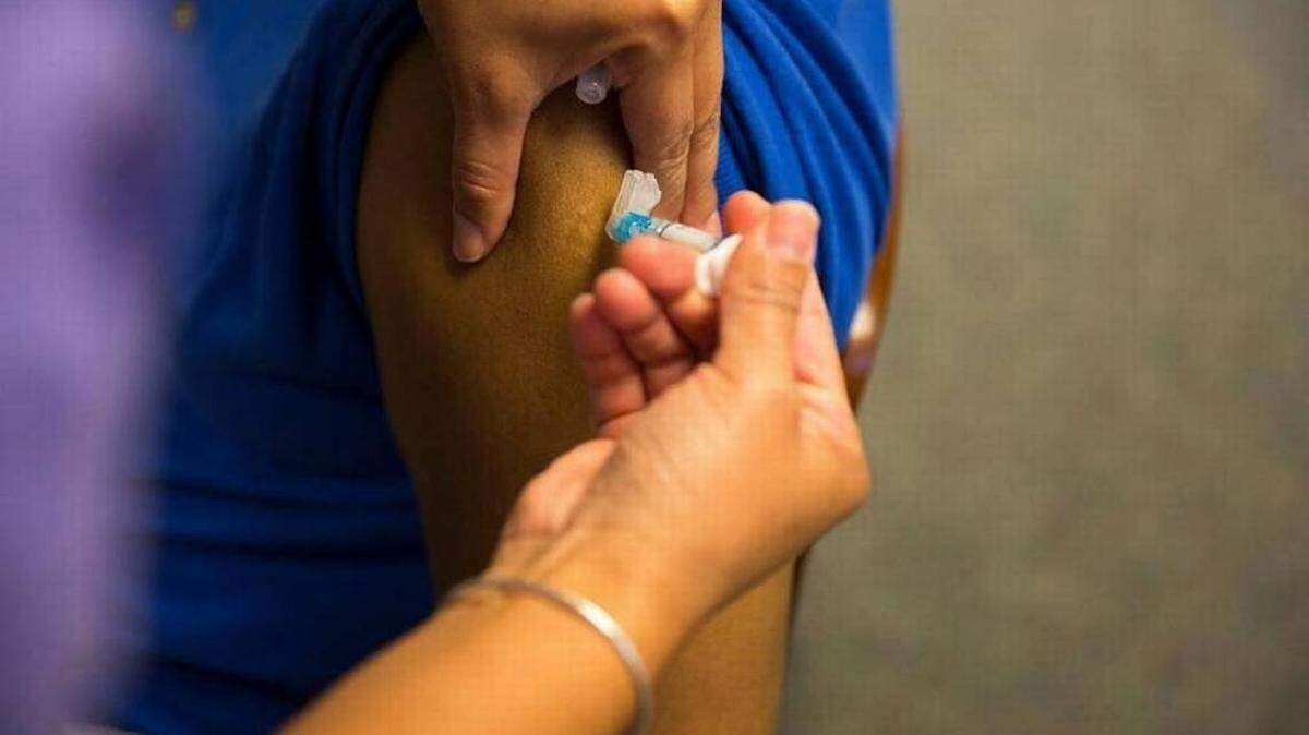 An image of a flu shot being administered.