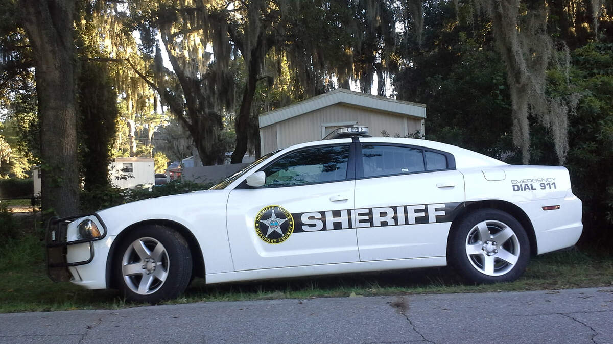 A Beaufort County Sheriff’s Office deputy patrol car sits parked outside Kent’s Court Mobile Home Park on West Paris Avenue in Port Royal, where a man was arrested after allegedly firing on Port Royal police officers with a shotgun. At least one officer shot back at the man when he exited his home. No one was injured.