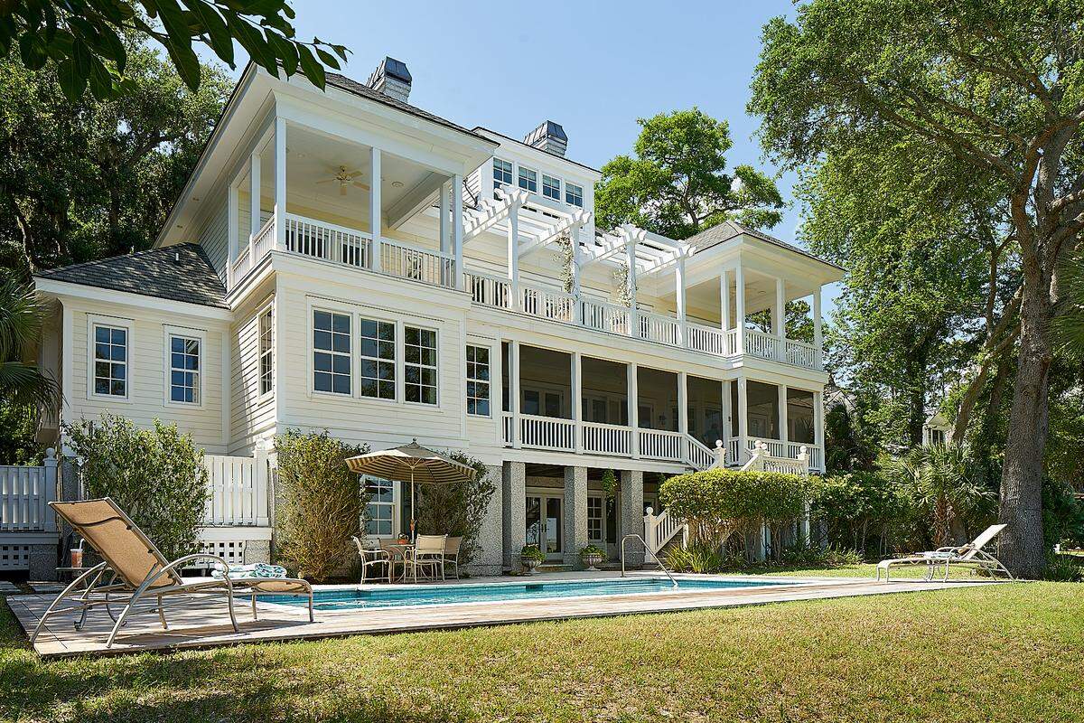 The back of the home includes a pool and balconies that face the Calibogue Sound.