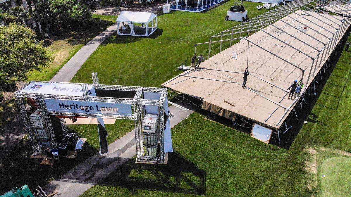 Workers install covered box seating at the 18th tee on Thursday, April 6, 2023, at Heritage Lawn at Harbour Town Golf Links at Sea Pines for this year’s RBC Heritage Presented by Boeing on Hilton Head Island.