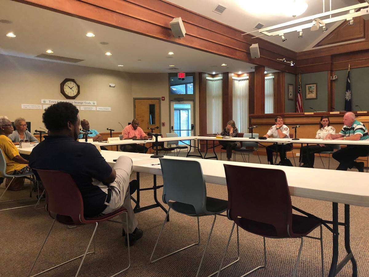 The Gullah-Geechee Land and Cultural Preservation Taskforce discusses fire hydrant location restrictions with town staff attorney Brian Hulbert, far right, and Town of Hilton Head Island Fire Rescue Chief Brad Tadlock and Fire Marshal Joheida Fister.