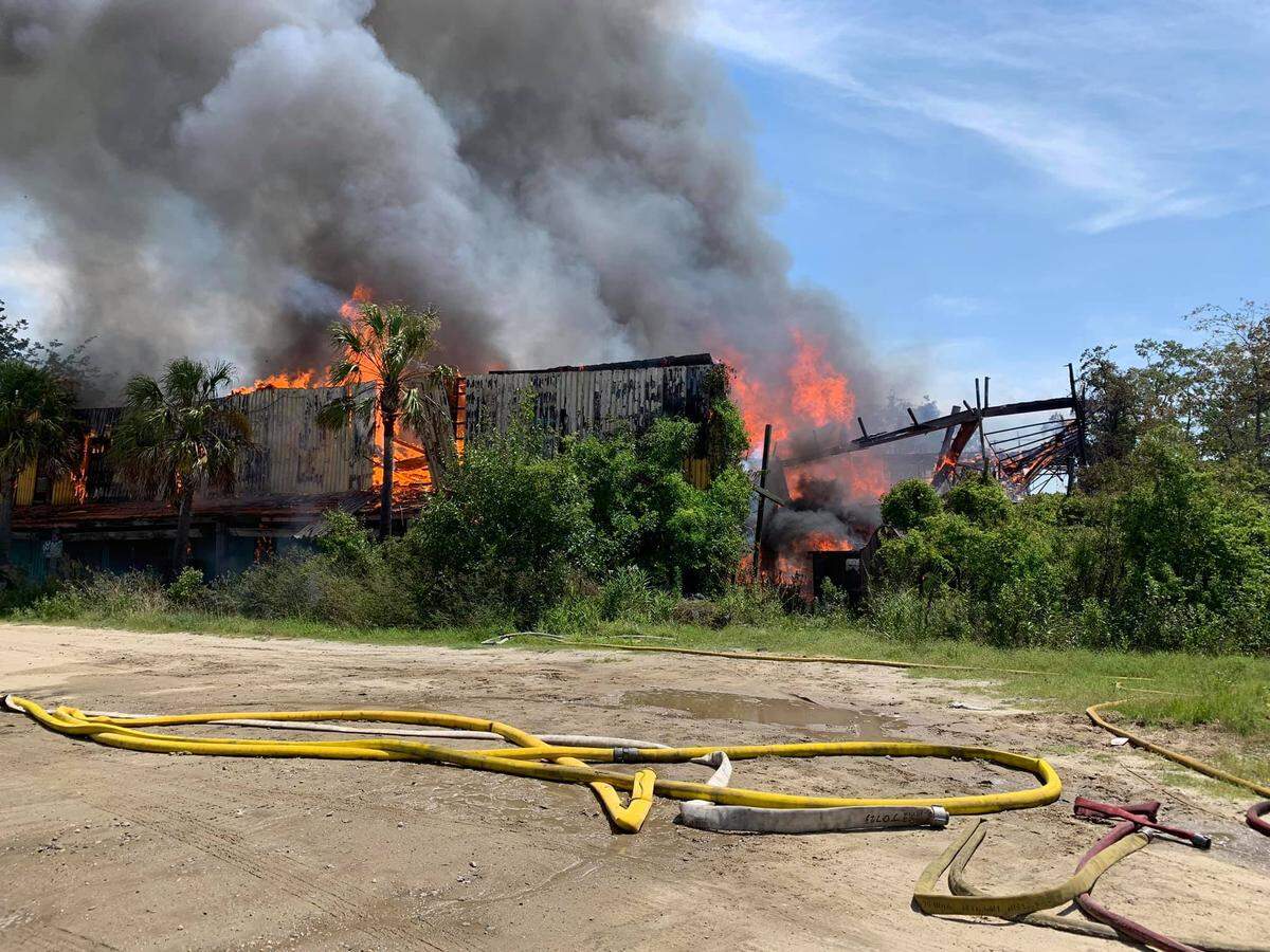 A fire destroyed an abandoned building north of the Talmadge Memorial Bridge at the Georgia, South Carolina border on Wednesday, July 15, 2020.