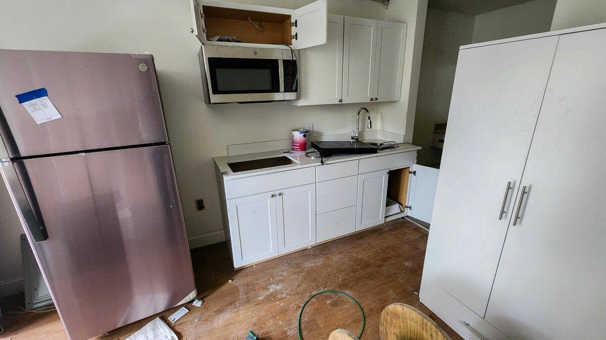 One of two spec rooms to determine flooring color, size and scope of cabinets and cupboards as photographed on April 4, 2025, for the remodeling of the former Quality Inn hotel into studio apartments located in Beaufort Town Center in Beaufort. Each apartment will have a refrigerator, cooktop and a microwave convection oven.