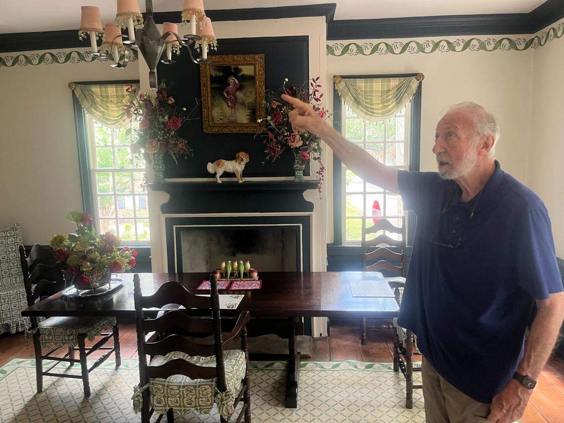 Owner David Taub points out a feature of the William Johnson House, which is believed to be the fourth oldest house in Beaufort. Taub has owned the property, which is for sale, since 1979.