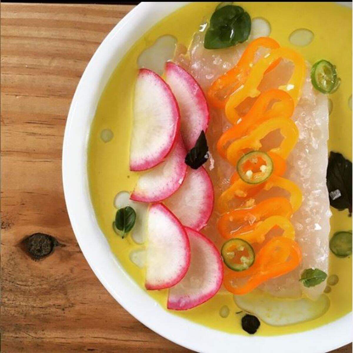 Flounder (crudo). Shaved radish. Sweet peppers. Little basil. Citrus emulsion. Flaked salt. Serrano chili oil.