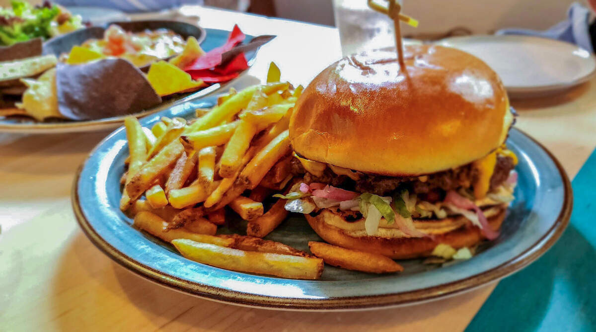 Lucky Beach Bar and Kitchen’s Beach Burger with fries is one of the main menu items.