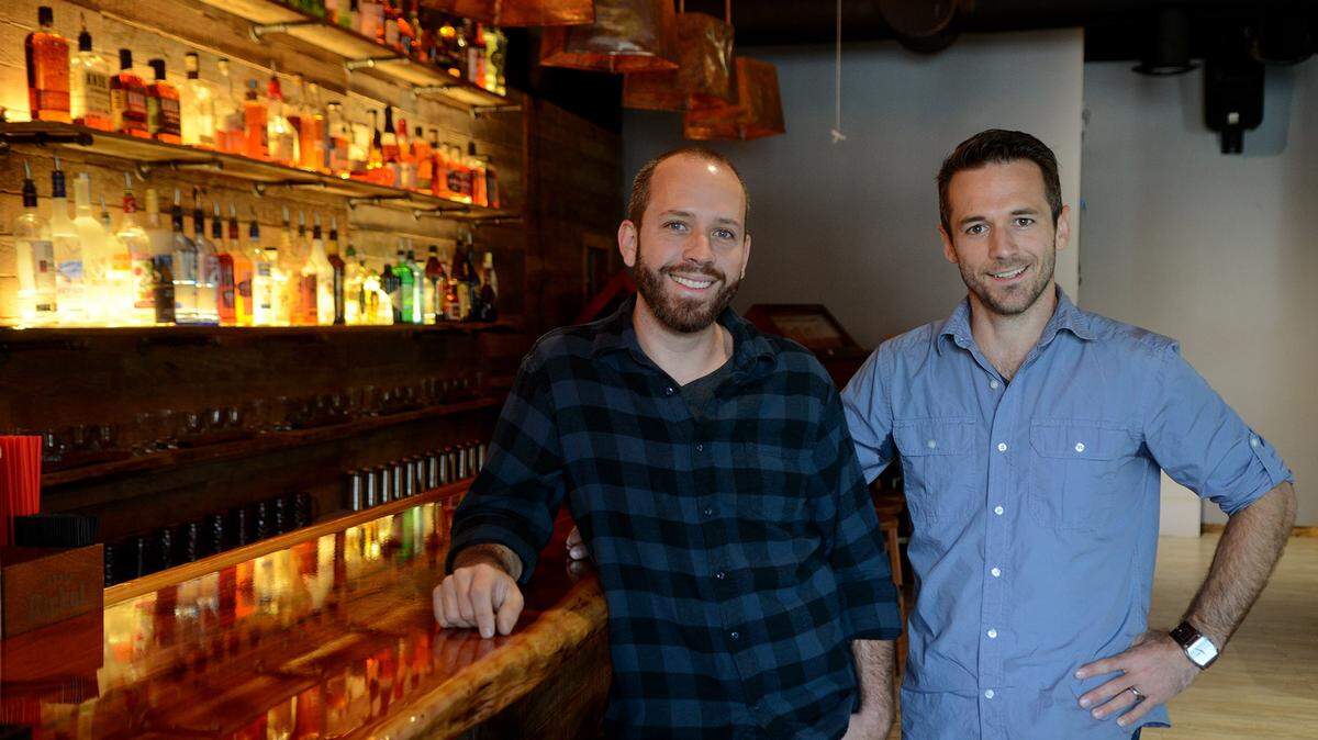 Josh Cooke, left, and Jordan Ross, right, stand for a portrait in The Roasting Room on Wednesday afternoon in Old Town Bluffton.  The Roasting Room, owned by Josh Cooke, is located above  Corner Perk, also owned by Cooke, and is a bar and small music venue where local artist can play their original music.  Ross genearally handles the music side of the venture.