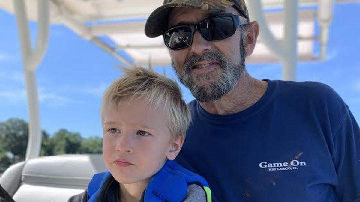 Collins and grandson Ben out on the water.