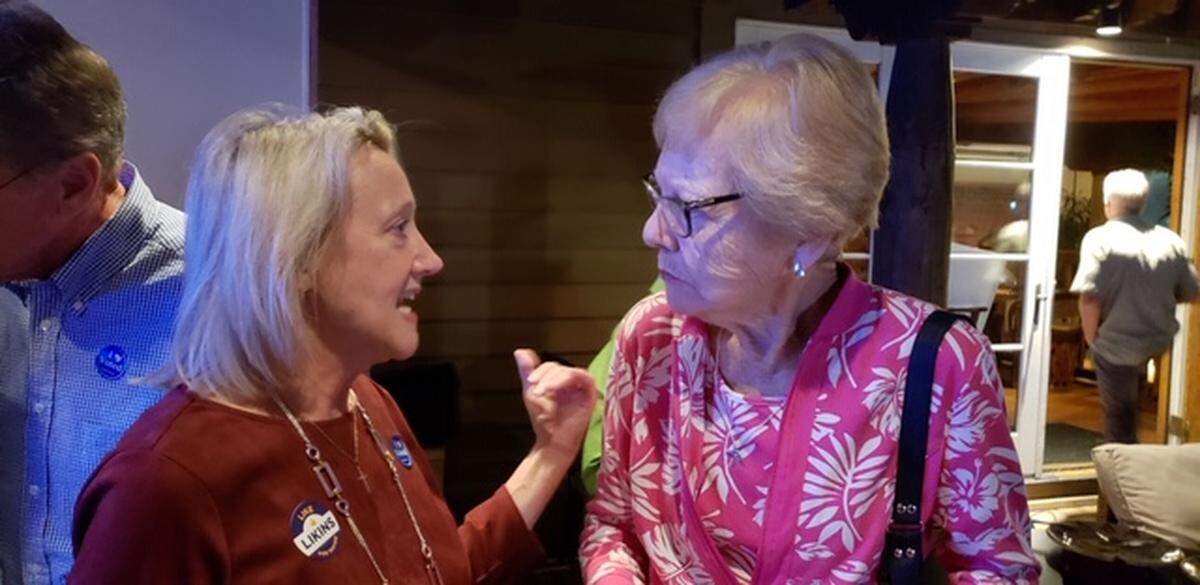 Mayoral candidate Kim Likins discusses her platform with a supporter at her election results watch party at Santa Fe cafe on Hilton Head on Tuesday, Nov. 6.