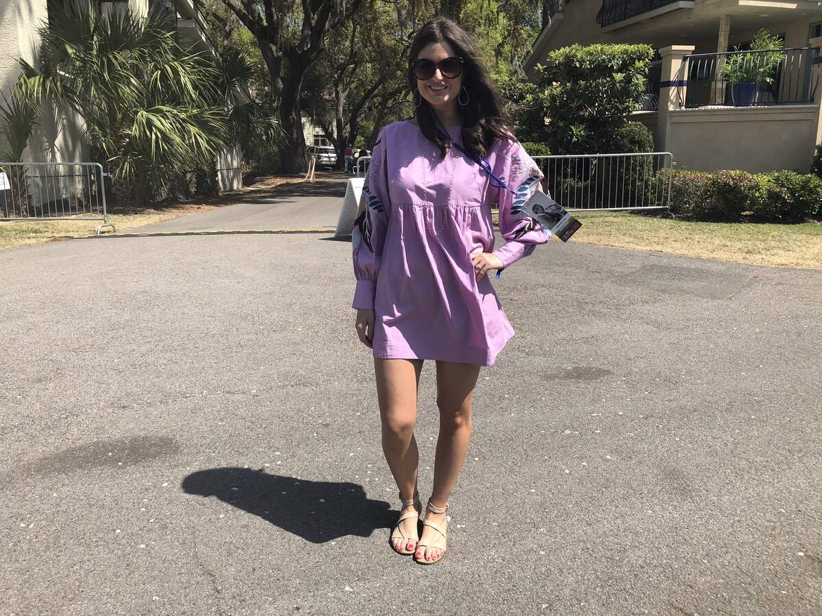 Olivia King, from Charleston, wore a lavender mini dress from Free People with embroidered feathers its puff sleeves.