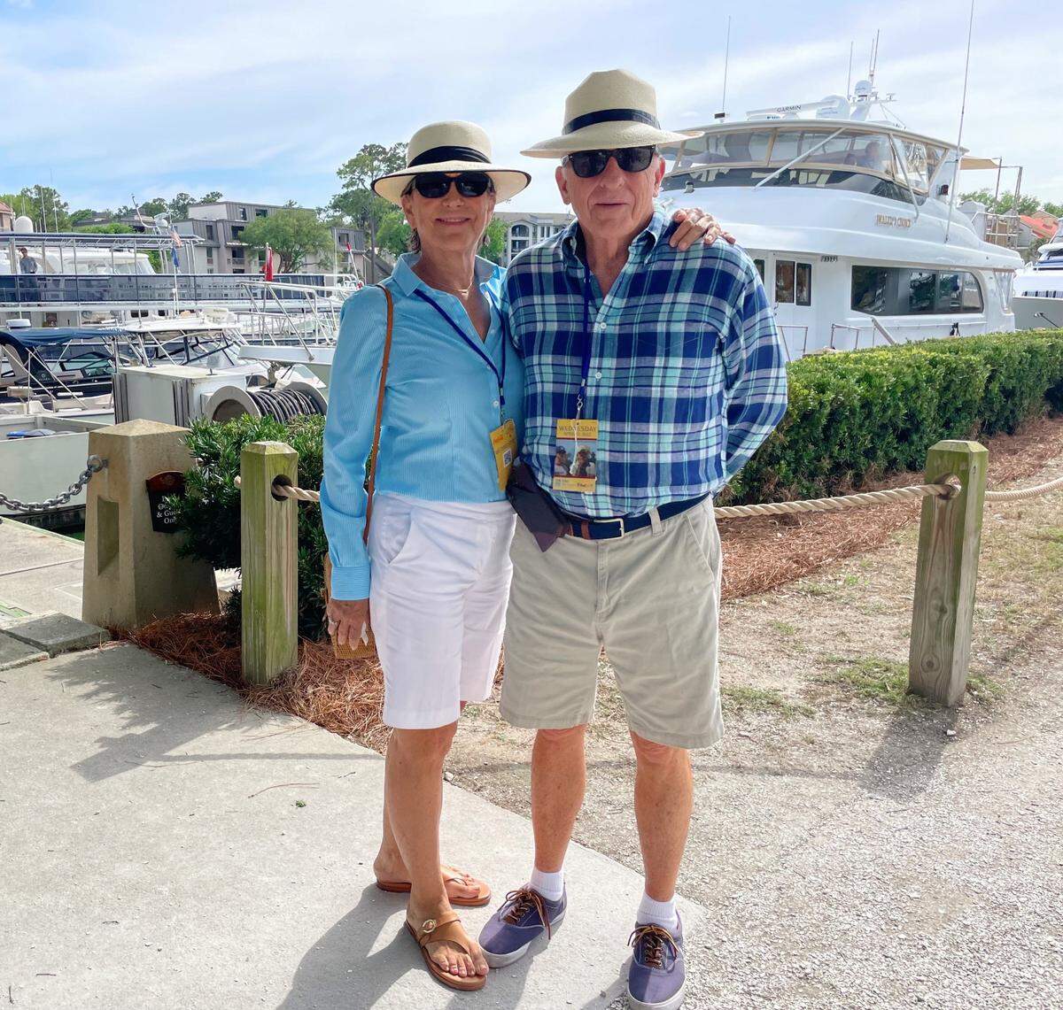 Margaret and Charles Bartley pose for a photo beside Harbour Town Yacht Basin during the 2022 RBC Heritage.