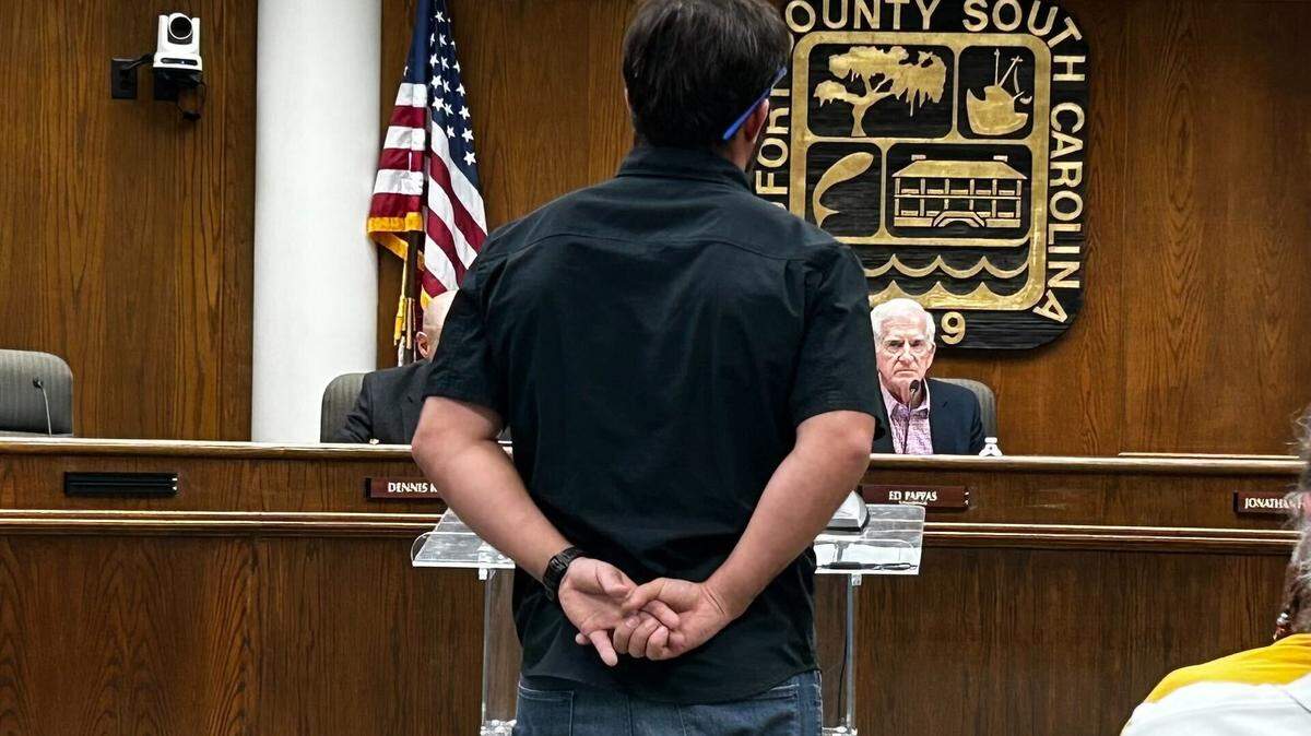 Pine Island Devloper, Elvio Tropeano, stands at the podium answering questions from the Planning Commision regarding his appeal of three denied golf courses