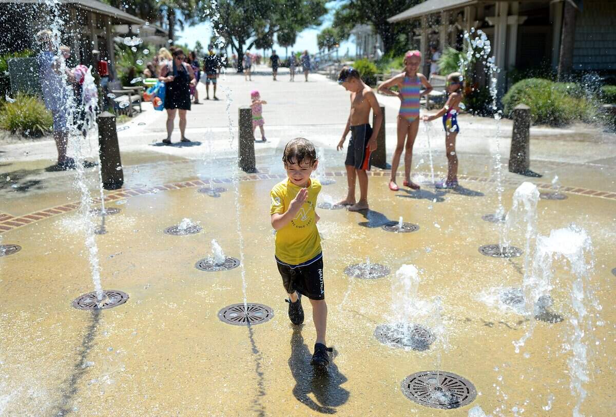 Ari Rreci, 4, of Bethel, Conn., runs through the splash pad at Coligny Beach Park on Tuesday, August 16, 2016, on Hilton Head Island.