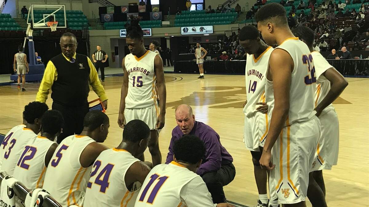 Whale Branch coach Jim Raymond talks to his team during the Class 2A Lower State championship on Saturday in Florence, SC