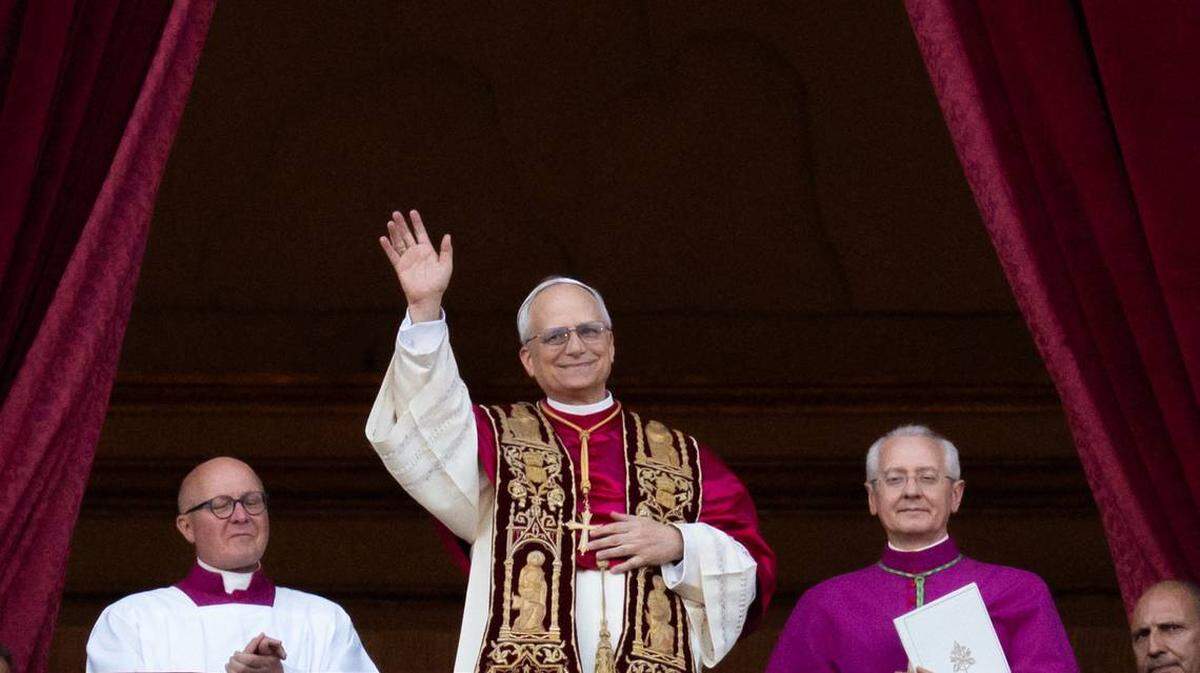 Newly elected Pope Leo XIV, Robert Prevost, arrives on the main central loggia balcony of St. Peter’s Basilica for the first time after the cardinals end the conclave in The Vatican, on May 8, 2025.