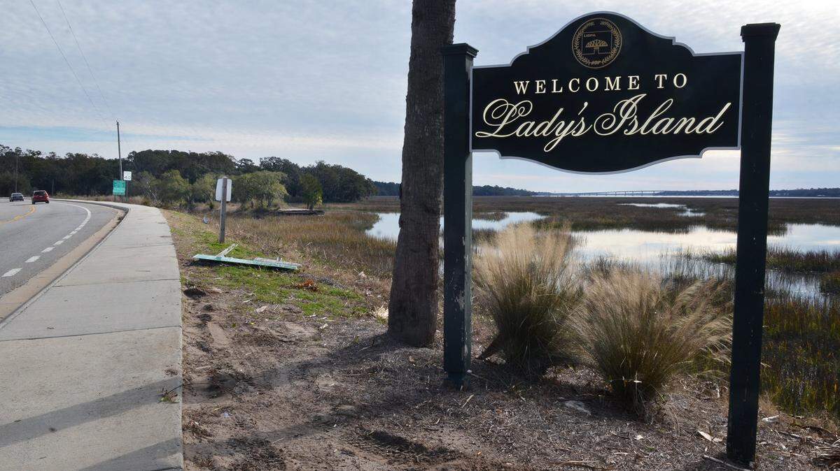 A sign along Sea Island Parkway just south of the Woods Memorial Bridge to downtown Beaufort welcomes motorists to Lady’s Island. In the background at left is the 19-acre Whitehall property. Developers plan to build commercial and residential units on the property but are willing to sell 10-acres for a public park.