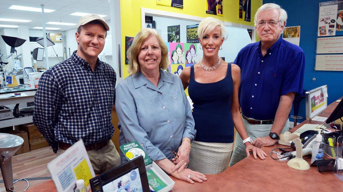 From left, Mike Tappeiner, Diane Sanders, Liz Auerbach and David Sanders are photographed at Island Photo and Camera on Thursday. Their long-time island camera store and photo lab will be closing at the end of the month.