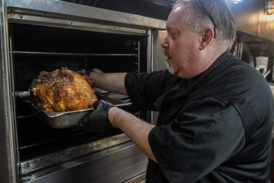 Executive Chef Eric Seaglund takes out cooked turkeys on Nov. 24, at Hudson’s Seafood House on the Docks on Hilton Head Island. The restaurant is gearing up for the annual Community Thanksgiving Dinner where it will serve hundreds of people family-style meals while also accepting donations to help local non-profits.