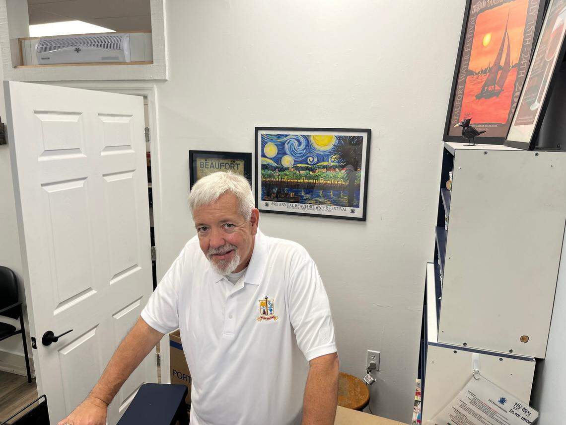 Todd Stowe stands at the entrance to the Beaufort Water Festival Headquarters where displays of past Water Festival themes are proudly displayed. Stowe is the commodore of the 69th Annual Water Festival, which begins Friday and concludes July 20.