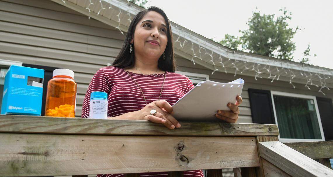 Hilton Head Island resident Velia Woods, who suffered heart damage due to COVID-19, displays medication on Wednesday, Sept. 23, 2020 she was prescribed, one of which is a supplement to replenish potassium in her body.
