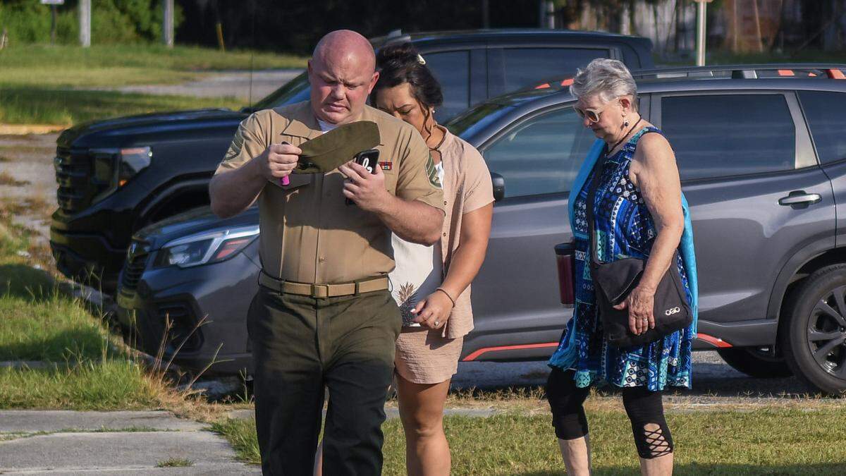 Adjusting his garrison cap, U.S. Marine Corps Staff Sergeant Steven Smiley arrives at Marine Corps Defense Services Organization Branch Office on Wednesday, July 26, 2023 in the continuation of his court martial on Marine Recruit Depot Parris Island. Smiley has plead not guilty to the charge of negligent homicide in the June 4, 2021 death of recruit Dalton Beals during “The Crucible.”&nbsp;