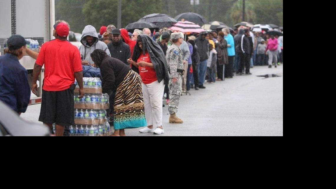 Lower Richland residents wait in line at Lower Richland High School for water Oct. 5, 2015, after catastrophic flooding hit the Midlands.